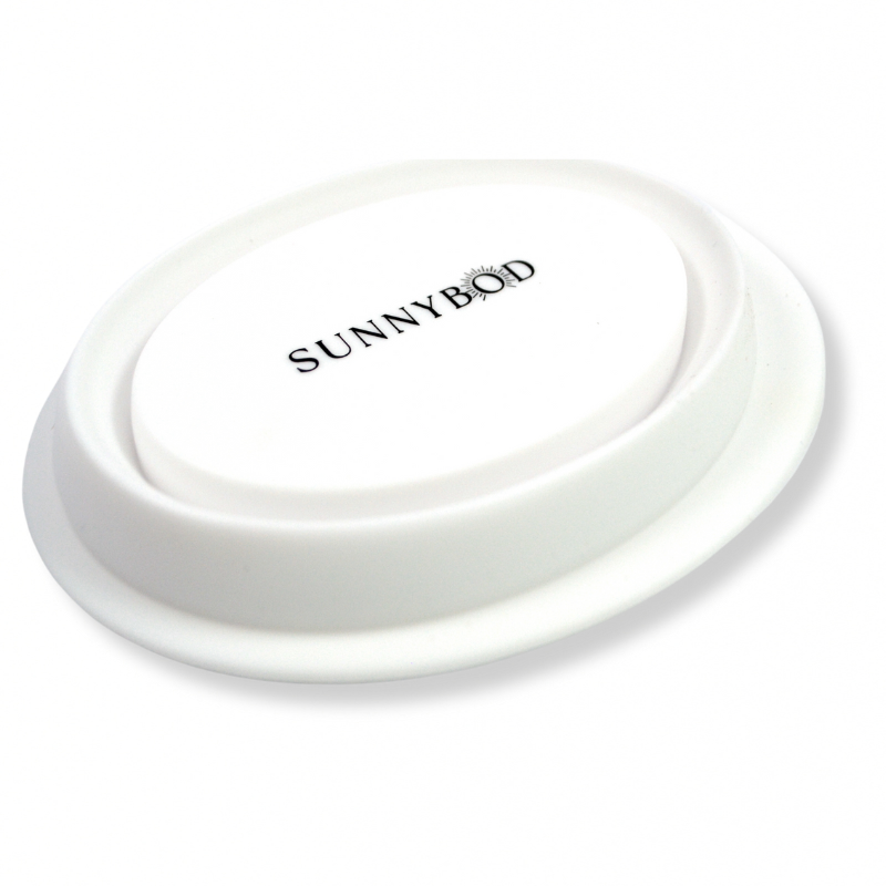 A picture of the bottom of a white SUNNYBOD™ Silicone Brush Cleaning Bowl. The picture is a side view of the bowl bottom. The bottom of the bowl has a black logo written in capital letters which reads "SUNNYBOD".